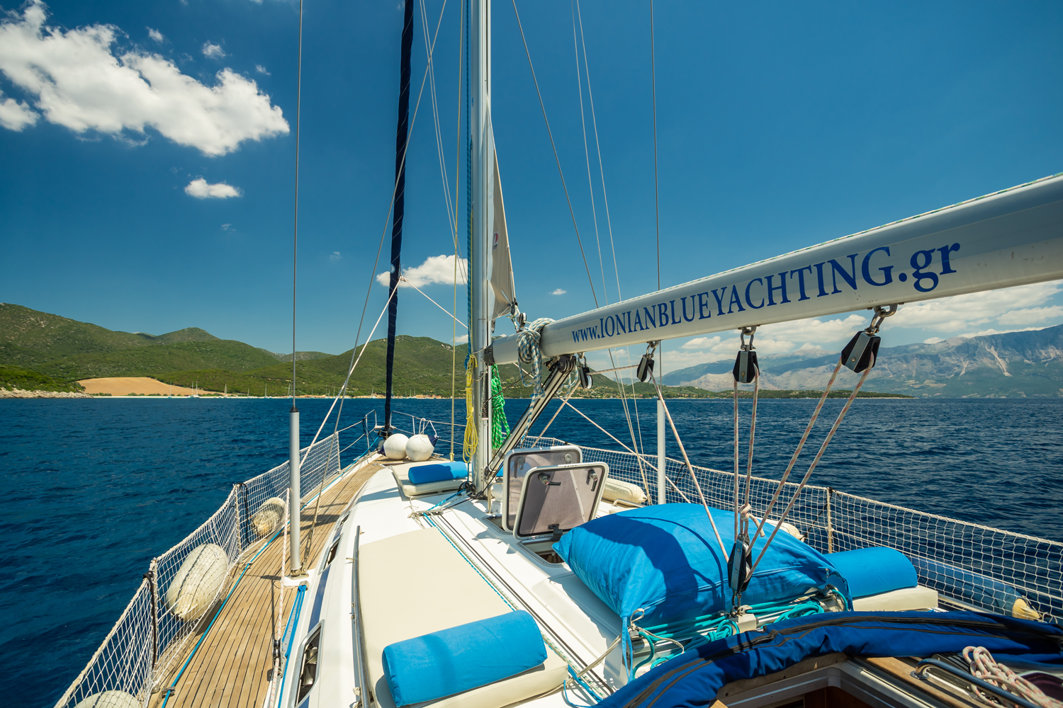 Forward deck view with Ionian Blue Yachting branding